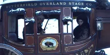 John Ruth (Kurt Russell) and Daisy Domergue (Jennifer Jason Leigh) on the stagecoach to Minnie's Haberdashery